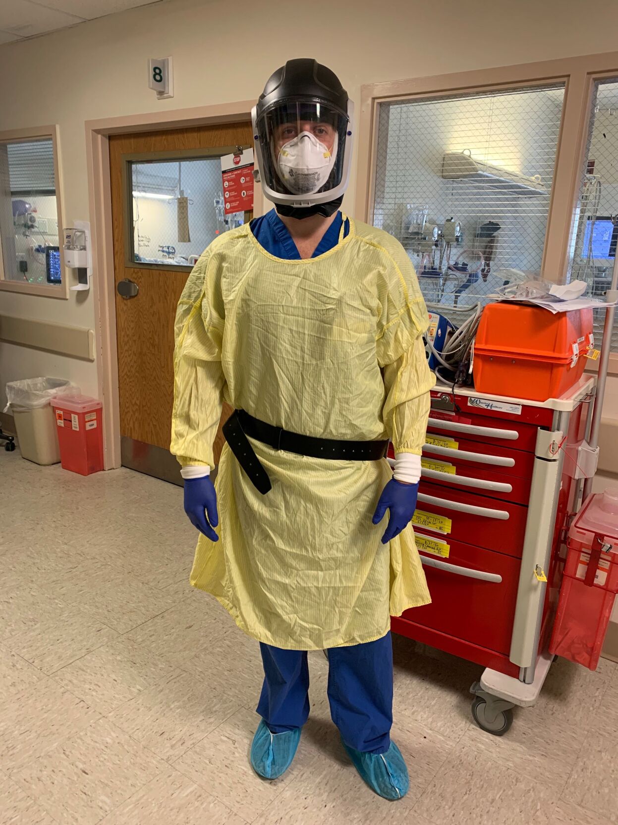 Nurse Mitch Haverstuhl dons PPE while working with COVID patients in NYC